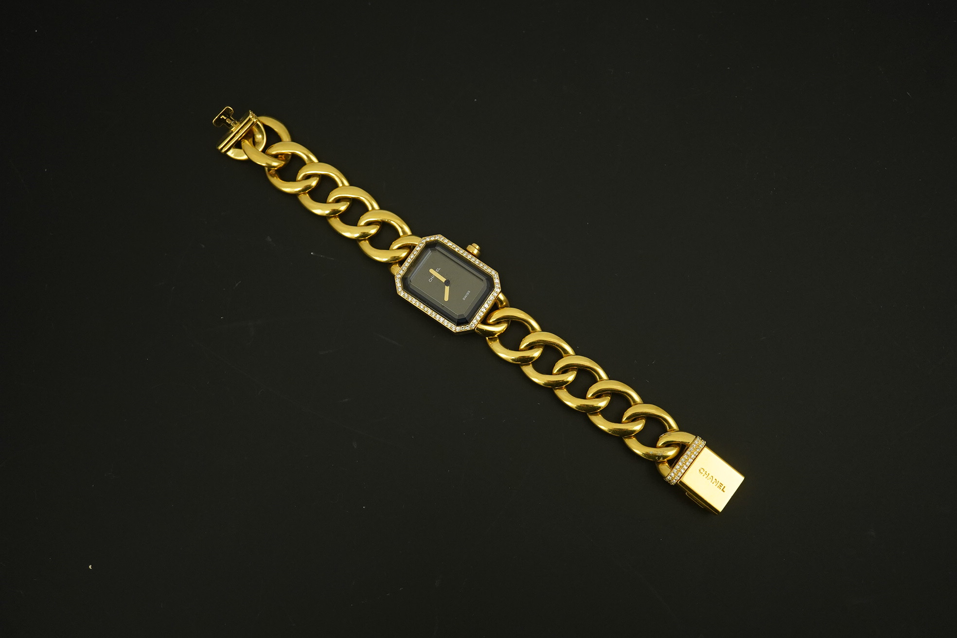 A lady's modern 18ct gold and diamond set Chanel quartz wrist watch, on an 18ct gold Chanel oval link bracelet